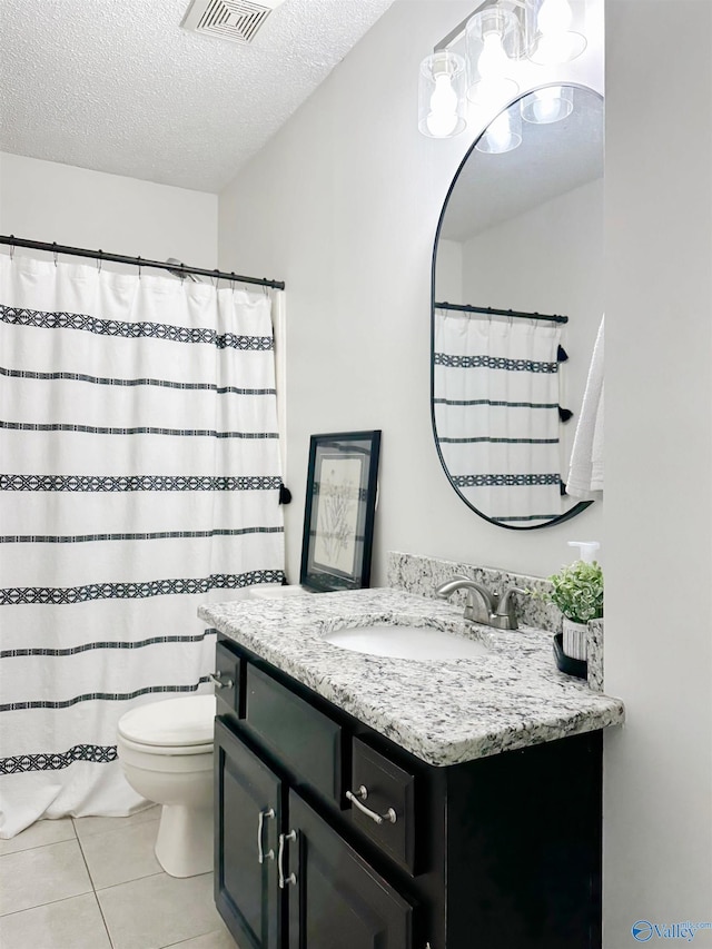 108 Mountain Home Rd, Trinity, AL 35673 - full bathroom featuring a textured ceiling, toilet, tile patterned floors, vanity, and a chandelier