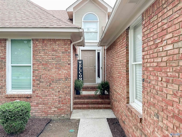 108 Mountain Home Rd, Trinity, AL 35673 - property entrance featuring brick siding and roof with shingles