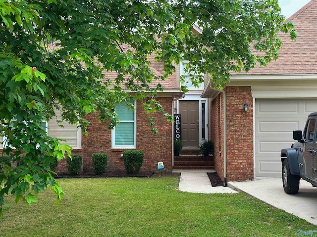 108 Mountain Home Rd, Trinity, AL 35673 - entrance to property featuring a lawn, a garage, and brick siding