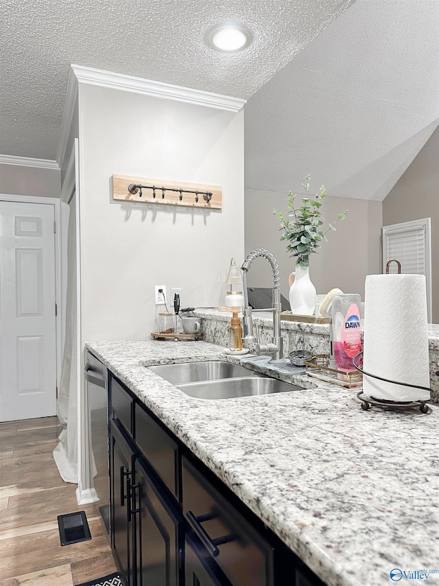 108 Mountain Home Rd, Trinity, AL 35673 - kitchen featuring a sink, a textured ceiling, crown molding, wood finished floors, and light stone counters