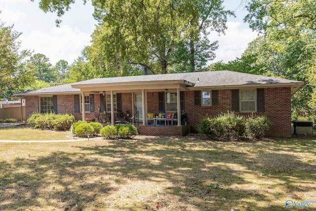 single story home with a front lawn and a porch