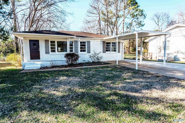 ranch-style home with a carport and a front yard