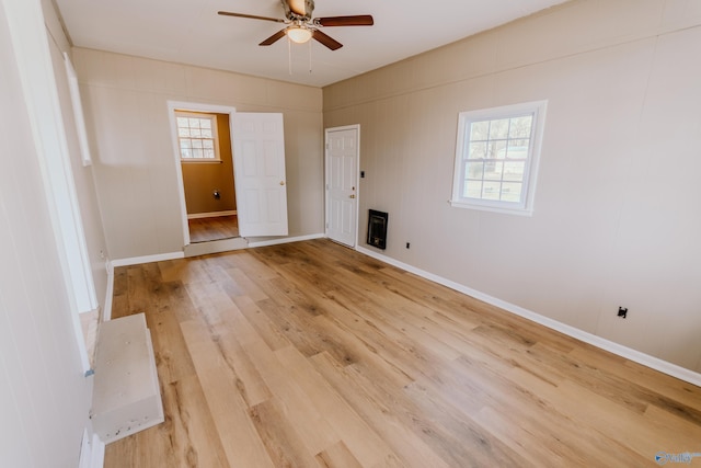 empty room with hardwood / wood-style flooring and ceiling fan