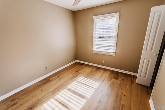 unfurnished room featuring hardwood / wood-style flooring and ceiling fan