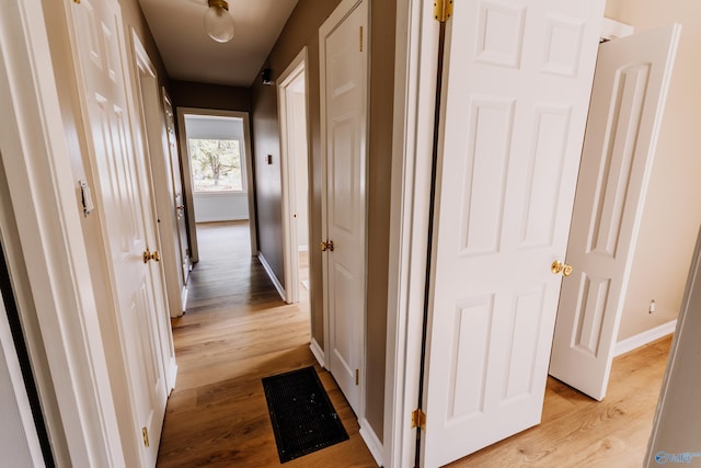 corridor featuring light wood-type flooring