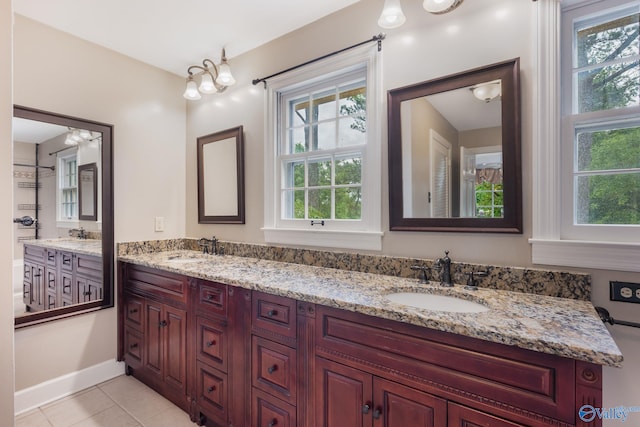 bathroom featuring tile patterned flooring and double vanity