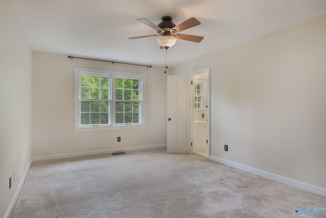 carpeted empty room with ceiling fan