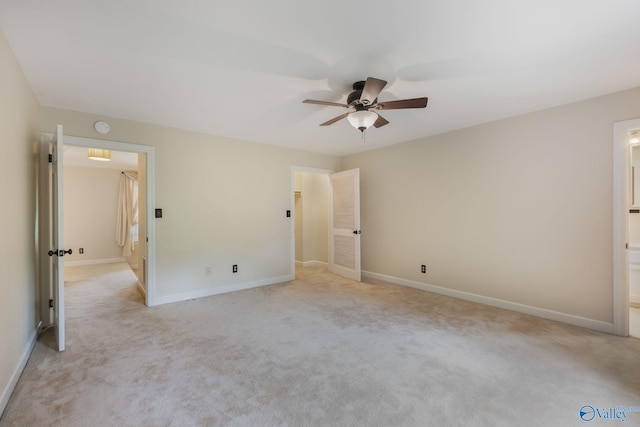 unfurnished bedroom with light colored carpet and ceiling fan