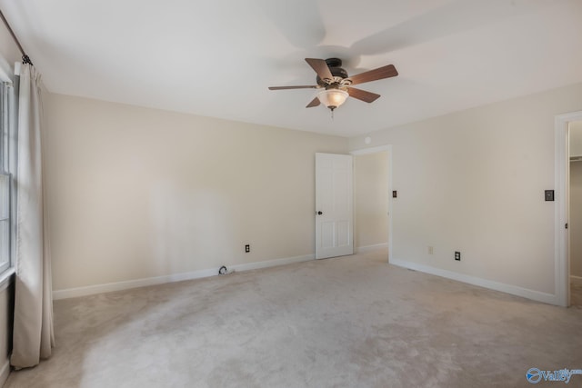 unfurnished room with light carpet and ceiling fan