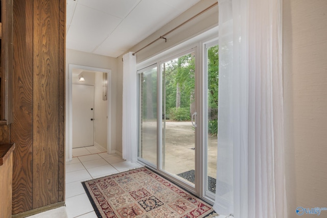 entryway with light tile patterned floors