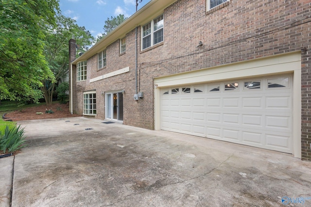 view of side of property featuring a garage