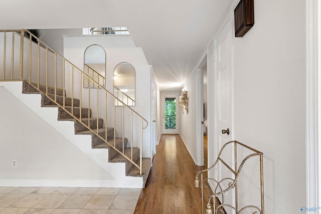 102 Fern Cv, Florence, AL 35634 - foyer featuring baseboards and stairway