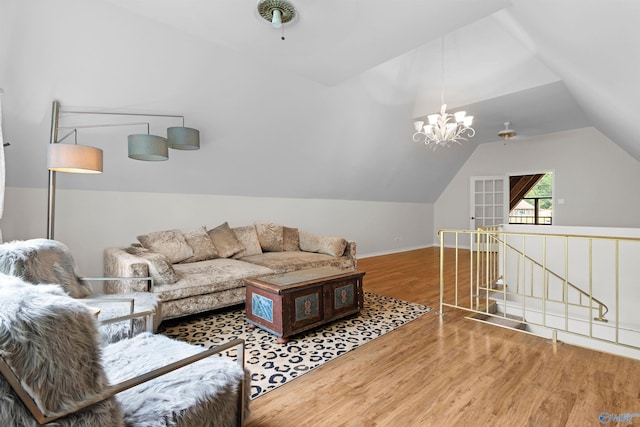102 Fern Cv, Florence, AL 35634 - living room featuring wood finished floors, lofted ceiling, and a chandelier