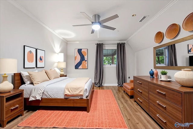 102 Fern Cv, Florence, AL 35634 - bedroom featuring multiple windows, light wood-style flooring, crown molding, baseboards, and ceiling fan