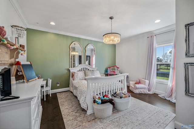 bedroom with dark hardwood / wood-style flooring, crown molding, and a chandelier