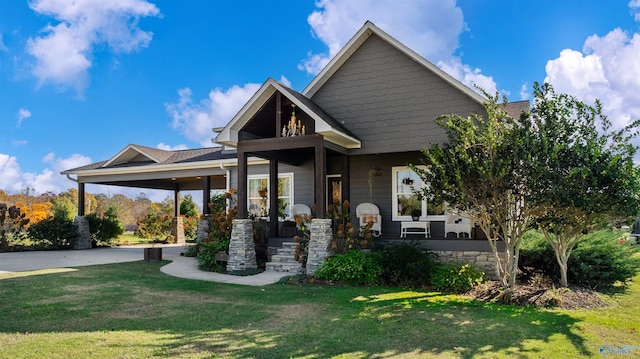 craftsman house with a front lawn and covered porch