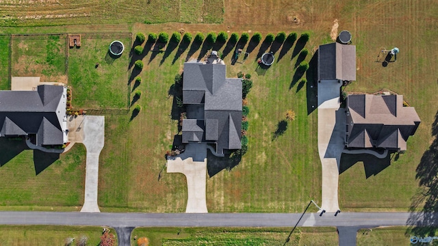 birds eye view of property with a rural view