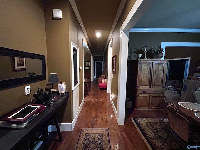 hall with crown molding and dark wood-type flooring