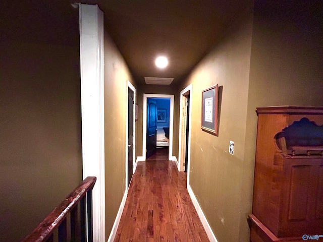 hallway with dark hardwood / wood-style flooring