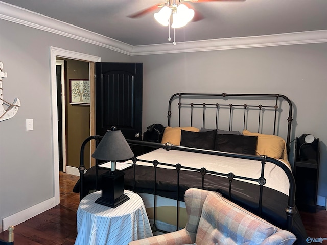 bedroom featuring dark hardwood / wood-style flooring, ceiling fan, and crown molding