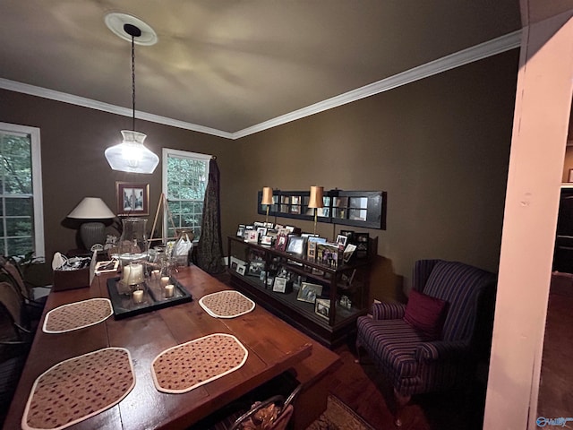 dining area with hardwood / wood-style floors and ornamental molding