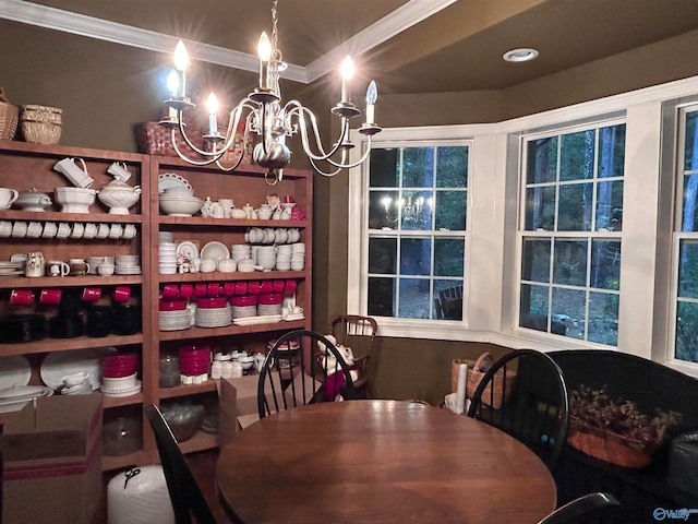 dining area featuring an inviting chandelier and ornamental molding