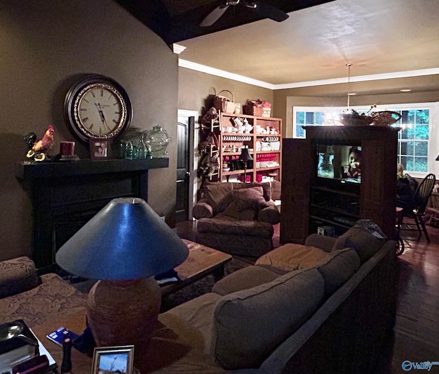 living room featuring hardwood / wood-style floors, ceiling fan, and crown molding