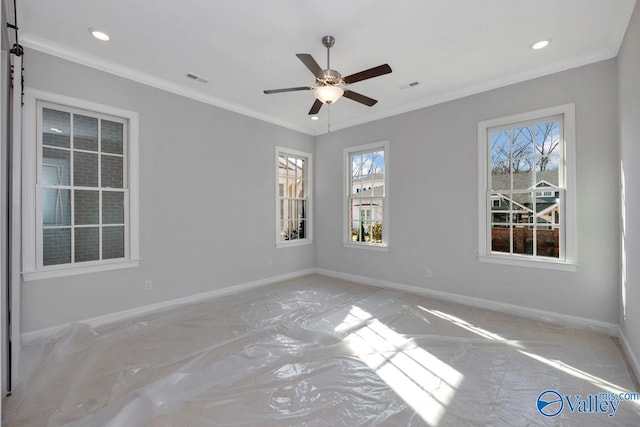 spare room featuring ceiling fan and ornamental molding