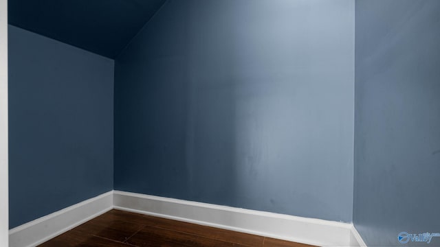 110 Ginamey Cir, Meridianville, AL 35759 - empty room with dark wood finished floors and lofted ceiling