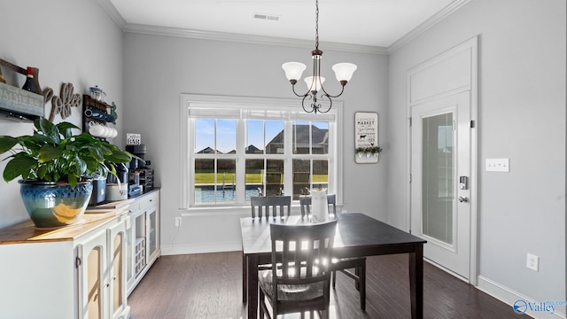 110 Ginamey Cir, Meridianville, AL 35759 - dining room with a chandelier, dark wood-type flooring, and ornamental molding