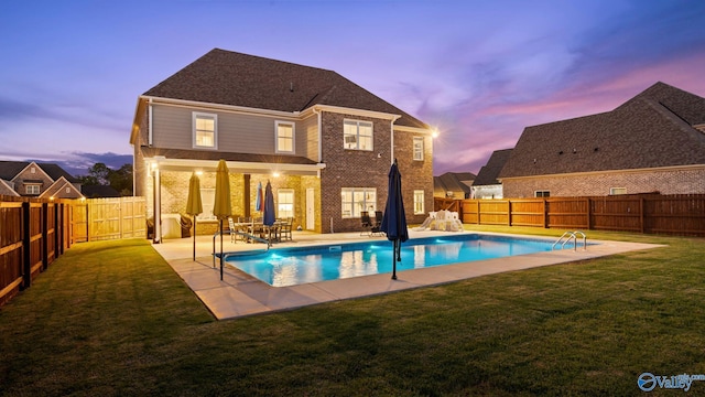 110 Ginamey Cir, Meridianville, AL 35759 - back of house at dusk featuring a fenced backyard, a patio area, and brick siding