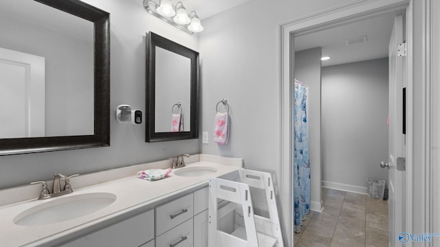 110 Ginamey Cir, Meridianville, AL 35759 - bathroom with double vanity and a shower with shower curtain