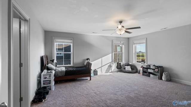 110 Ginamey Cir, Meridianville, AL 35759 - carpeted bedroom featuring multiple windows and ceiling fan