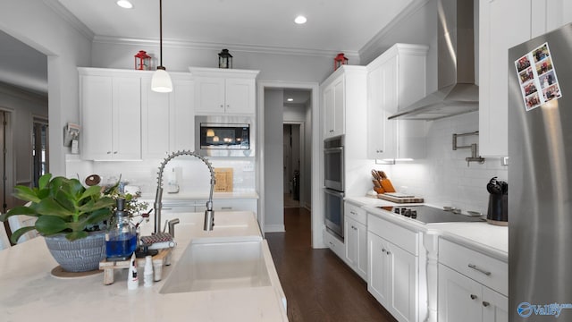 110 Ginamey Cir, Meridianville, AL 35759 - kitchen with wall chimney exhaust hood, stainless steel appliances, white cabinets, light countertops, and recessed lighting