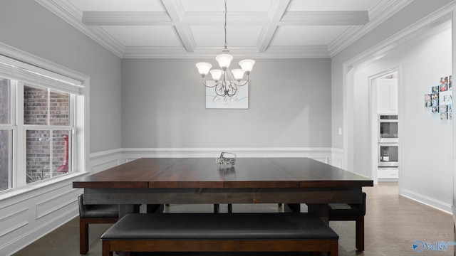 110 Ginamey Cir, Meridianville, AL 35759 - dining space with coffered ceiling, a chandelier, beamed ceiling, crown molding, and wainscoting