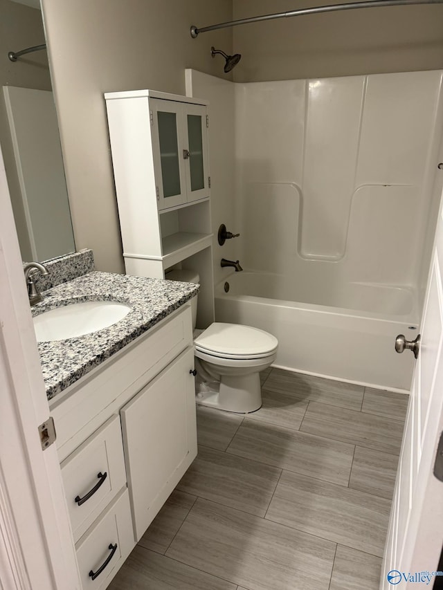 full bathroom featuring vanity, toilet, and tub / shower combination