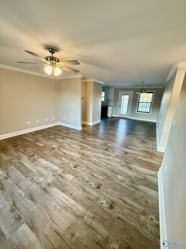 unfurnished living room featuring hardwood / wood-style floors, ceiling fan with notable chandelier, and ornamental molding