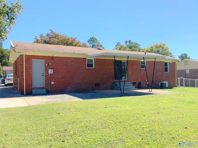 back of house featuring a patio area, a yard, and central AC unit