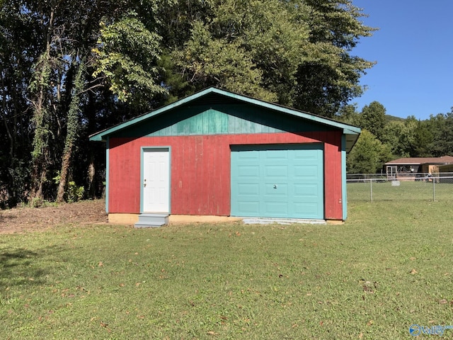 garage with a lawn