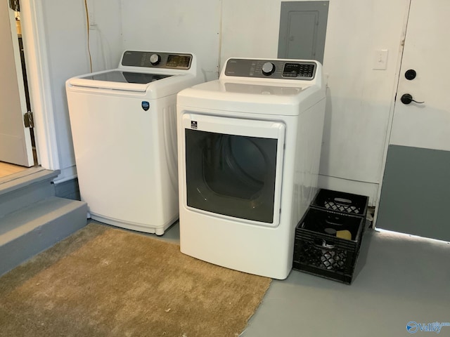 washroom featuring electric panel and washing machine and dryer