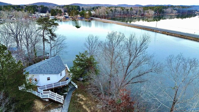drone / aerial view with a water and mountain view
