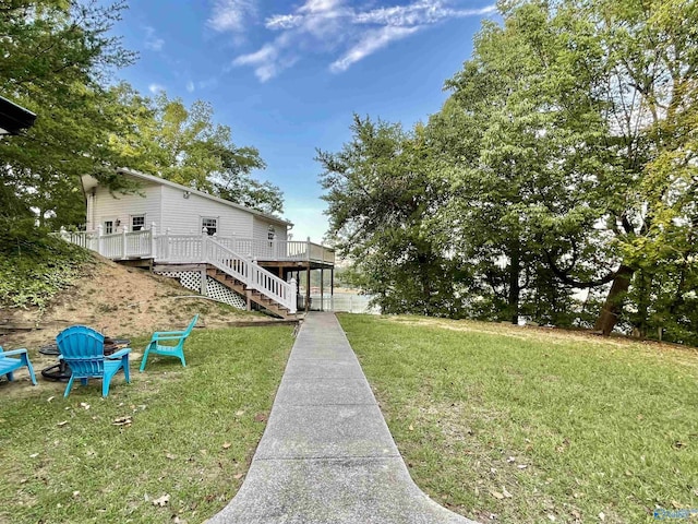 view of yard with stairs and a wooden deck