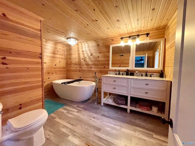 bathroom featuring wooden walls, a soaking tub, wood finished floors, and wood ceiling