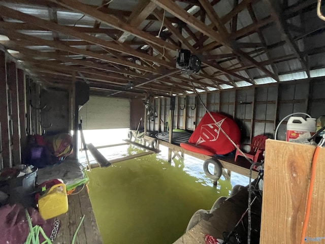 interior space featuring concrete floors and lofted ceiling