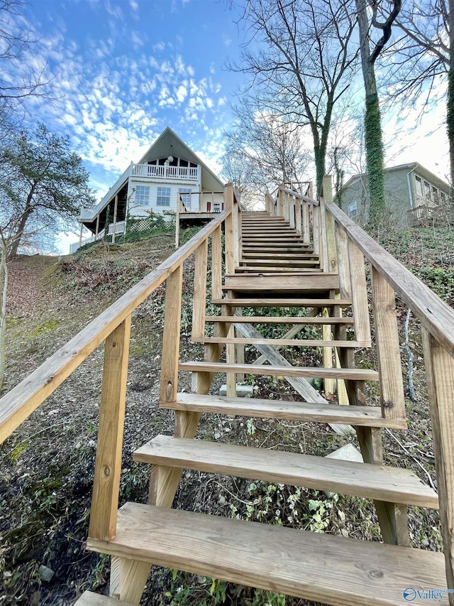 wooden terrace featuring stairway