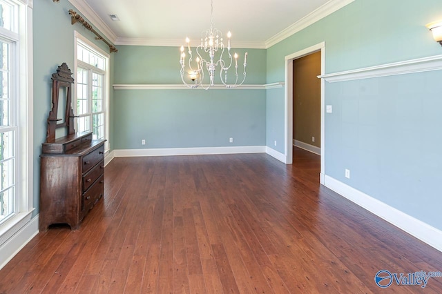 unfurnished dining area with crown molding, dark hardwood / wood-style floors, and a notable chandelier