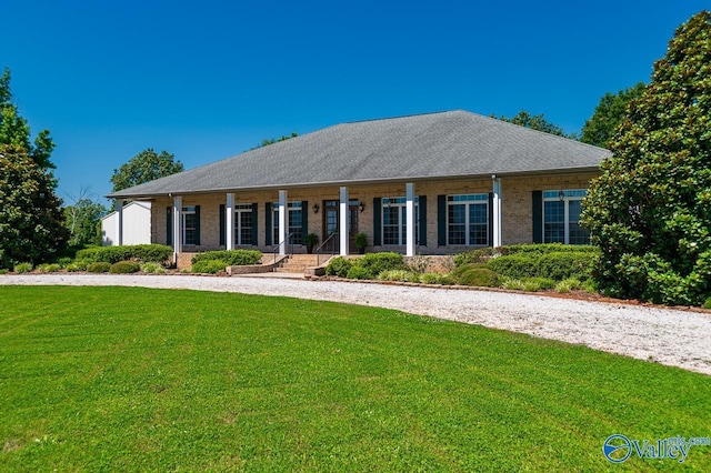 view of front of property with a porch and a front lawn