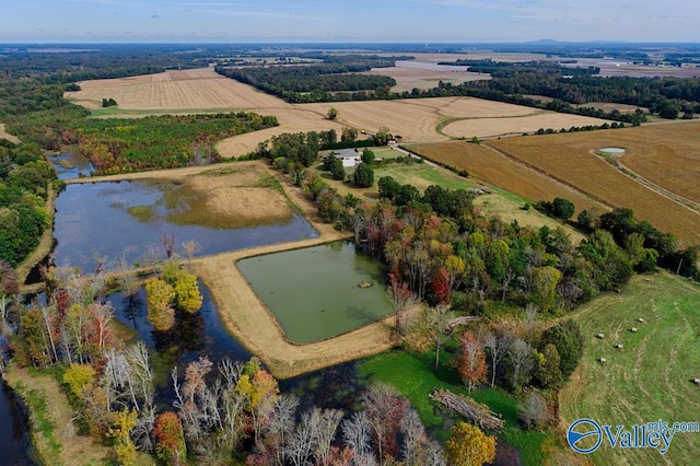 birds eye view of property with a rural view and a water view