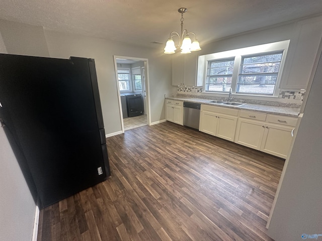 kitchen featuring white cabinetry, dishwasher, sink, backsplash, and decorative light fixtures