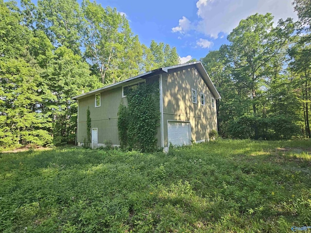 26095 Children Ln, Athens, AL 35613 - view of side of home with a garage